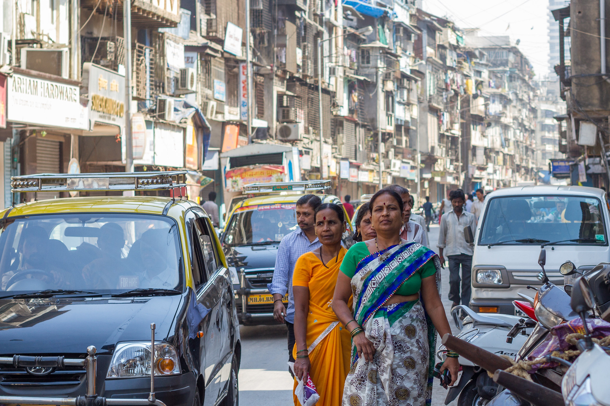 Women walking on a busy street in India