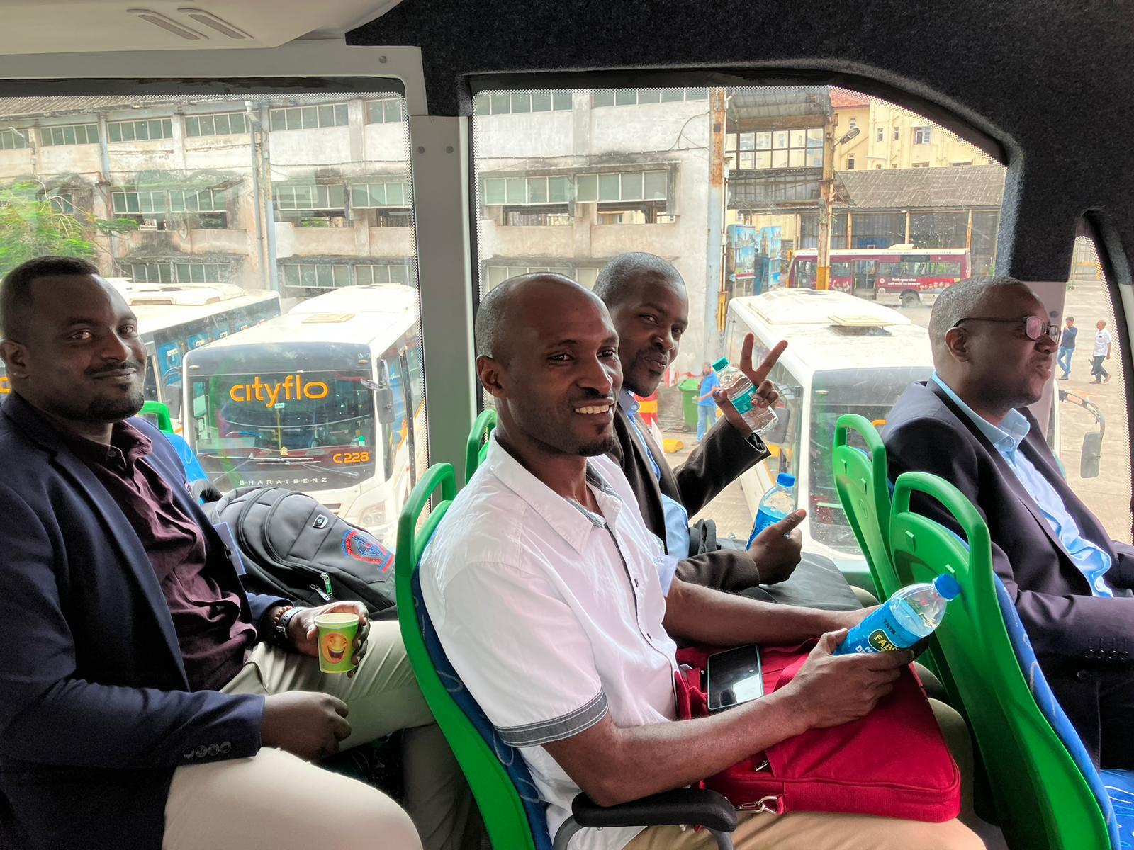 Participants in one of Mumbai's electric buses