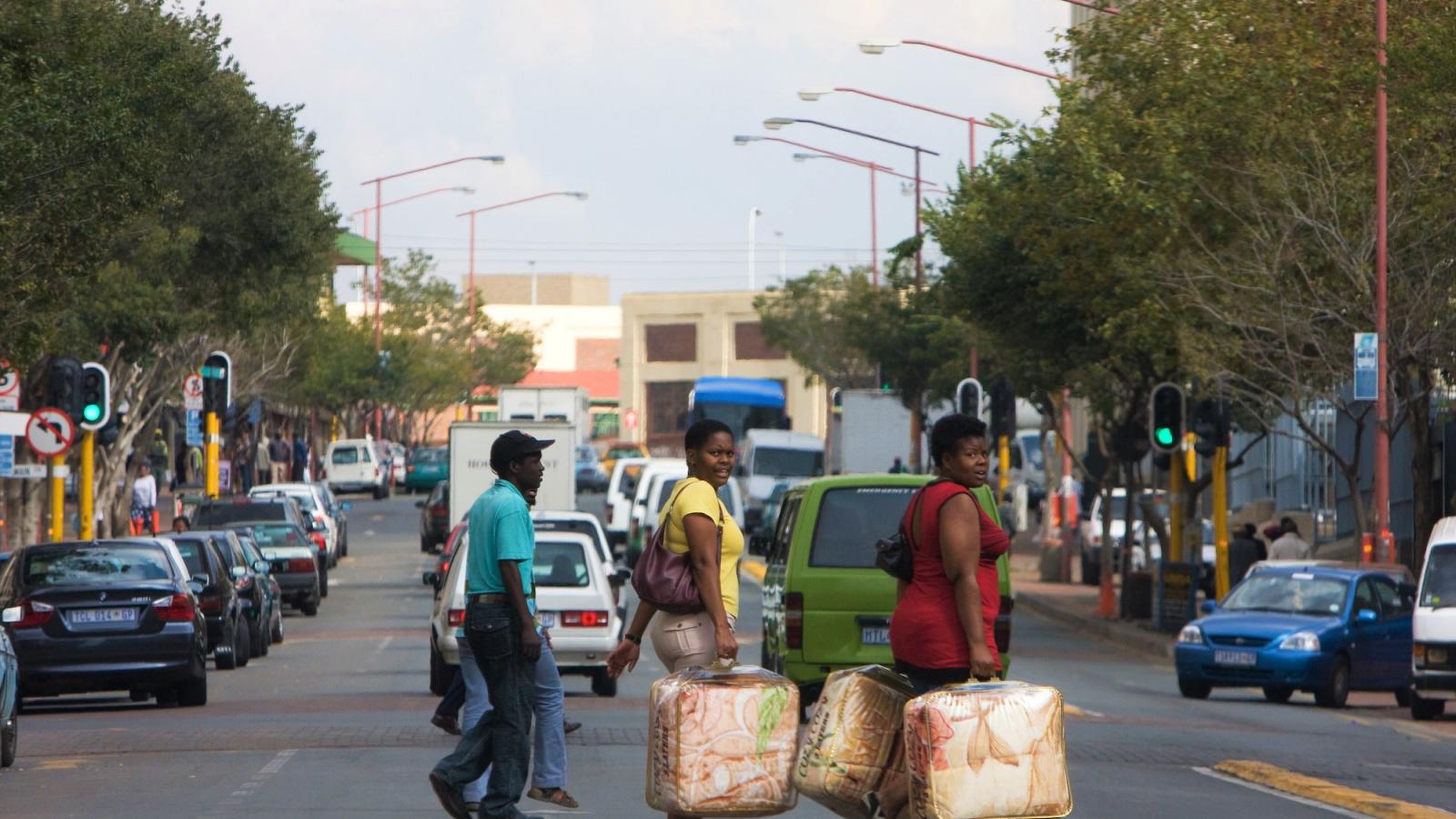 People crossing busy street in Johannesburg South Africa