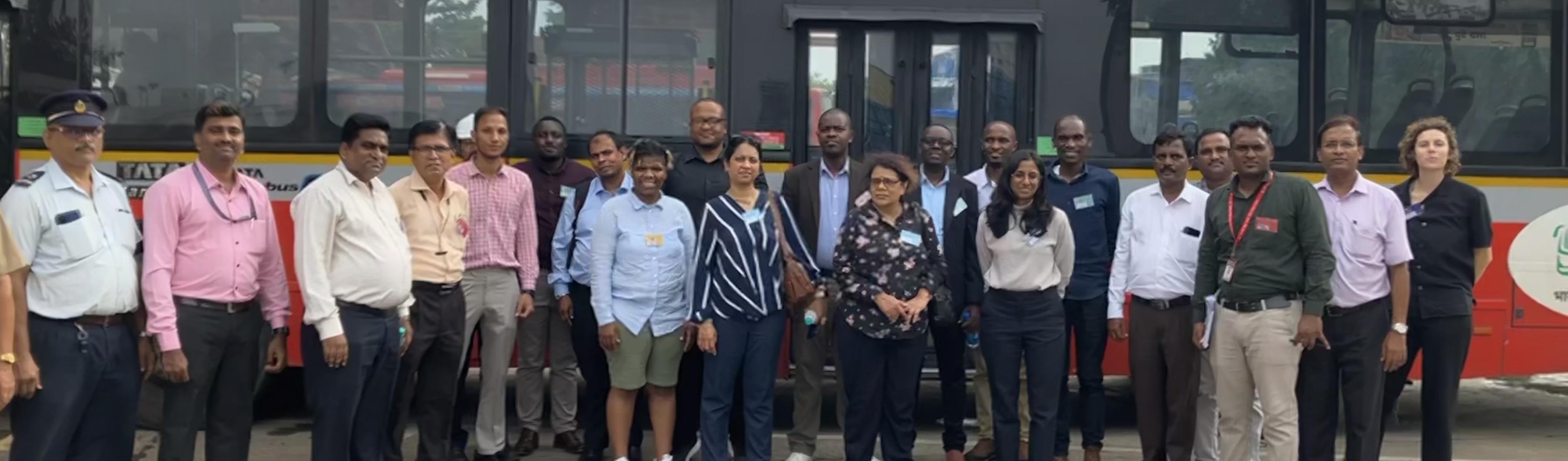 The UrbanShift Peer to Peer exchange participants in front of a zero-emission bus in Mumbai