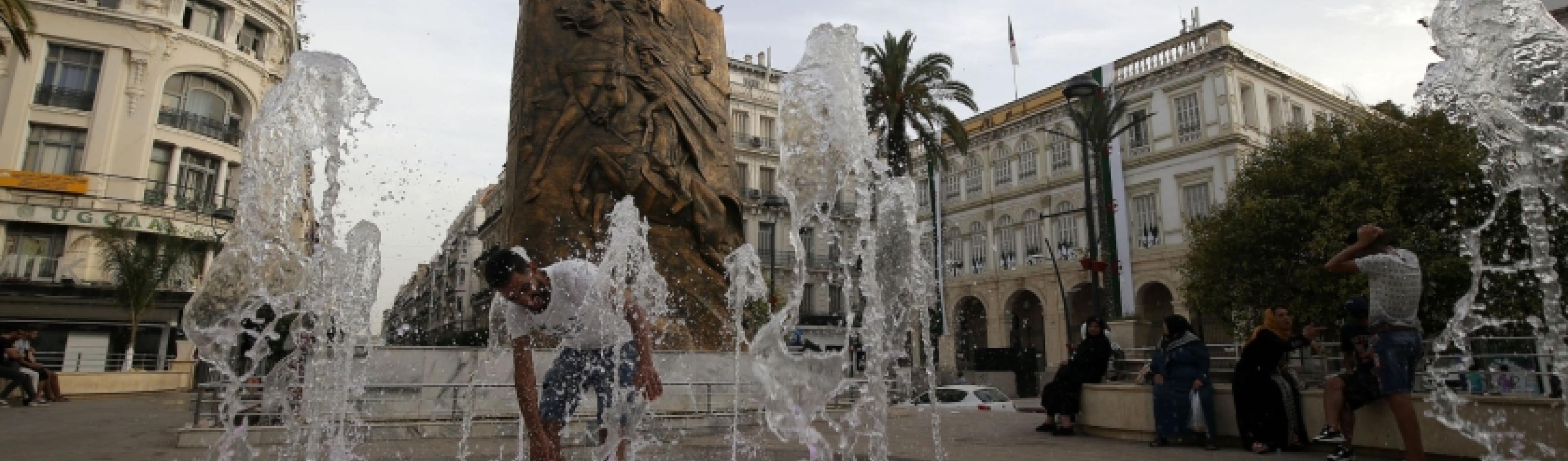 A man cools off at a splash pad in downtown Algiers, Algeria, where temperatures hit 42°C amid a heatwave that is roasting much of North Africa. 