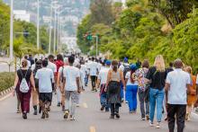 people walking down a car-free street in kigali